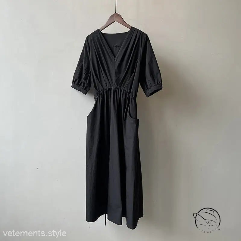 Retro V neck pleated midi dress in black with puff sleeves and pockets