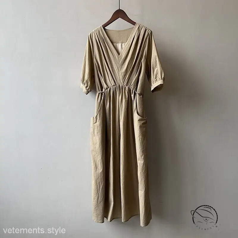 Retro v neck pleated dress in beige linen with V-neck, 3/4 sleeves, pockets