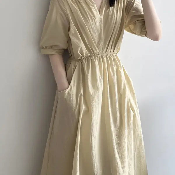 Pale yellow retro V neck pleated dress with short sleeves and cinched waist
