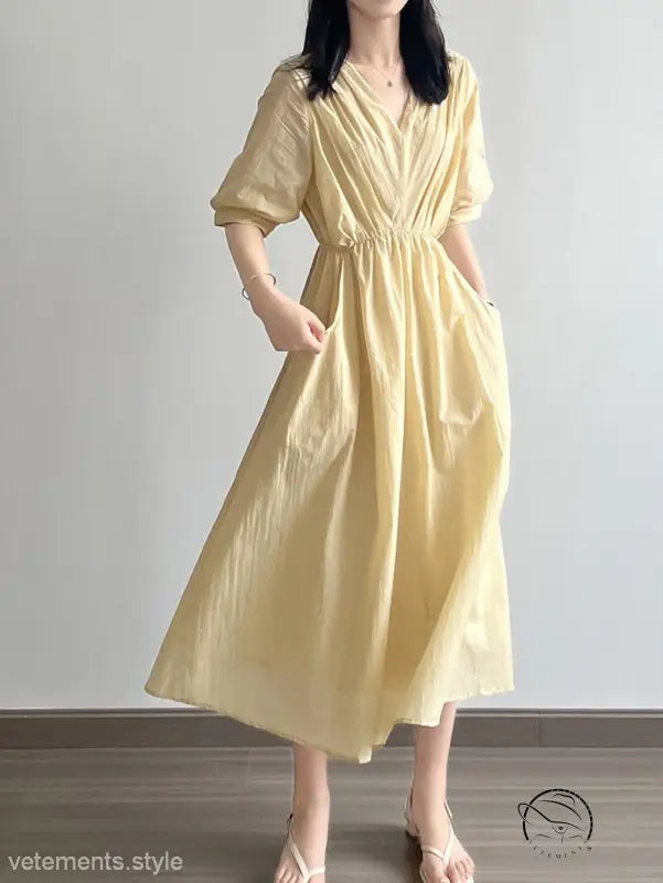 Retro V Neck Pleated Midi Dress in pale yellow with puffed sleeves