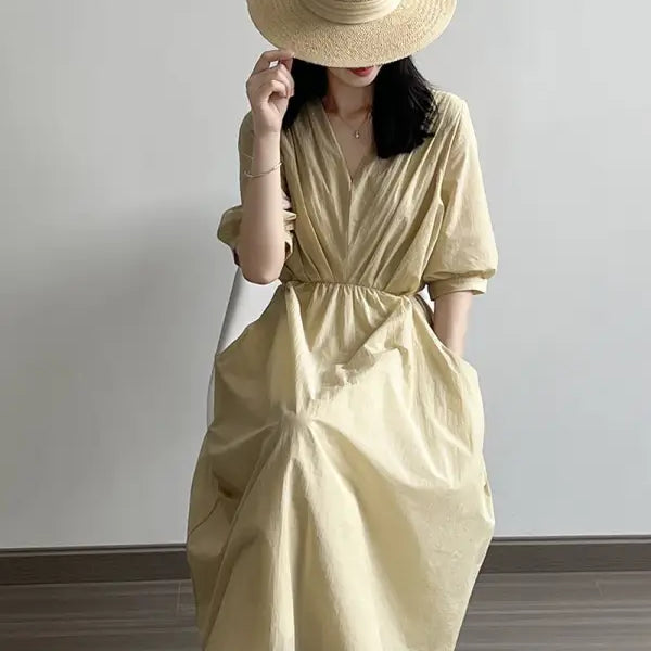 Pale yellow Retro V Neck Pleated Midi Dress with cinched waist and straw hat