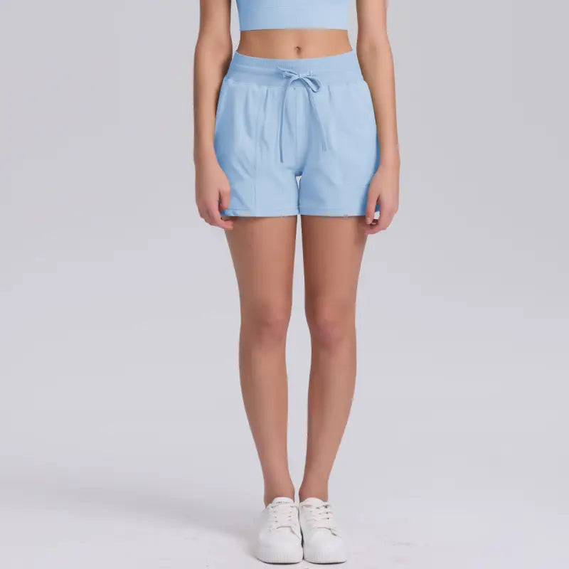 Light blue casual yoga shorts with solid pocket design for comfortable workouts