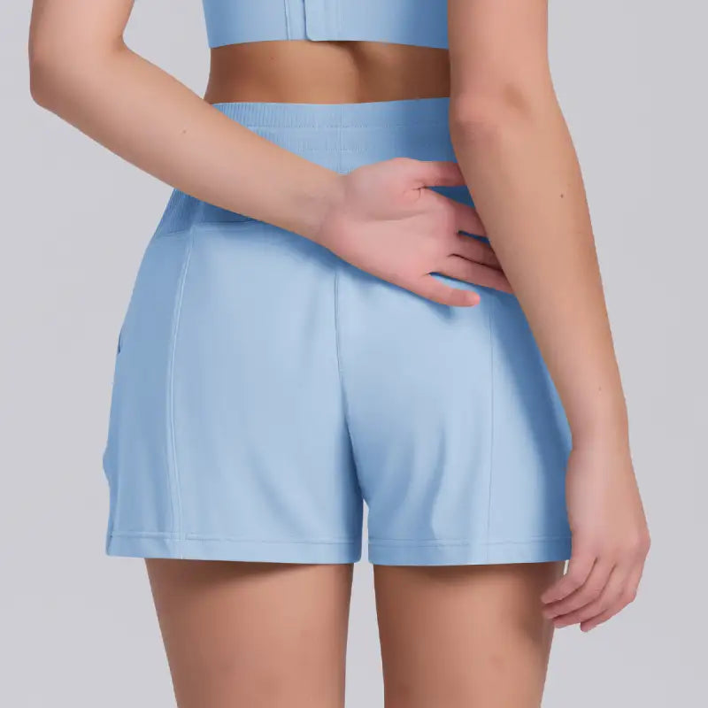 Light blue casual yoga shorts with solid pocket design for comfortable active wear