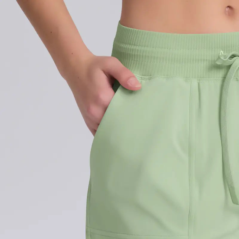 Light green casual yoga shorts with solid pocket design for comfortable active wear