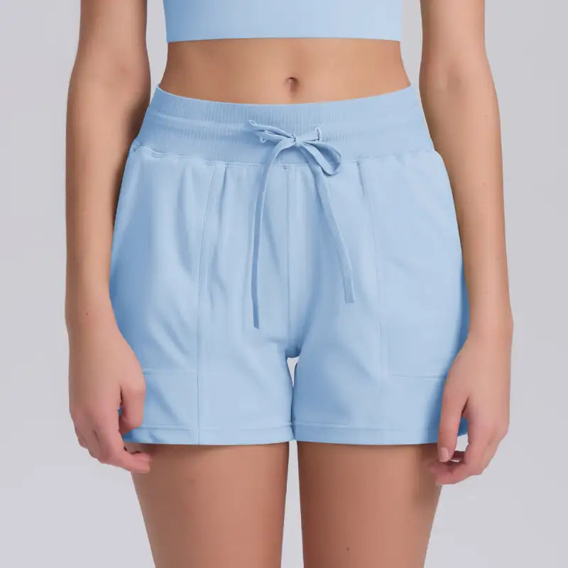 Light blue casual yoga shorts with drawstring and solid pocket design