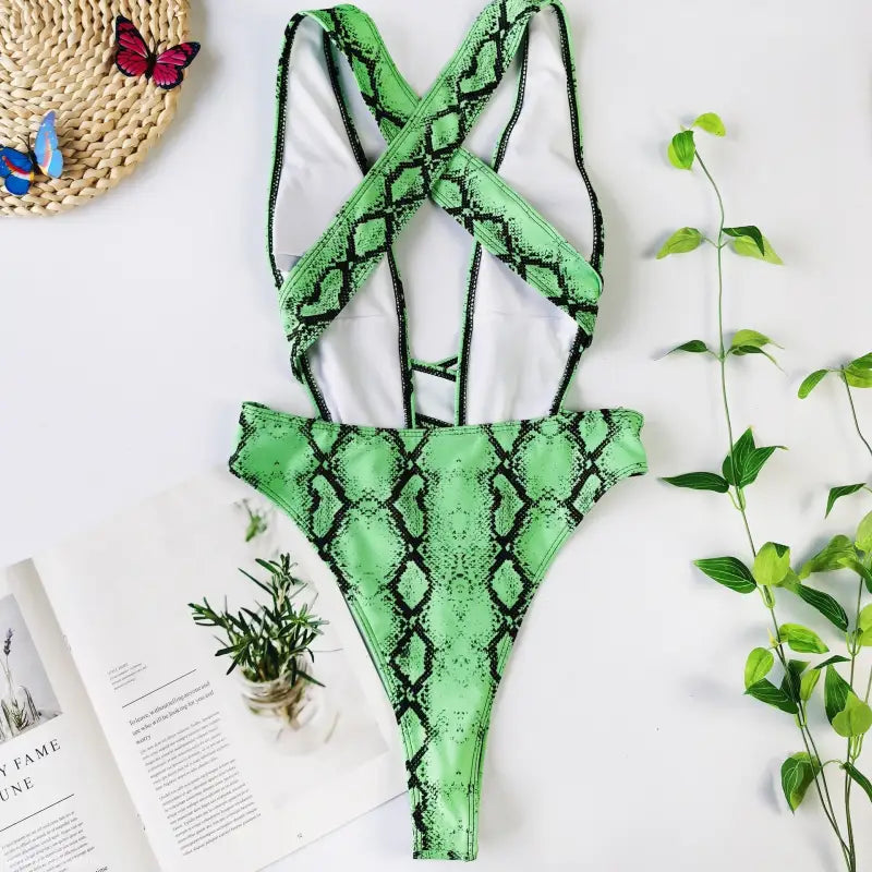 Green snakeskin one-piece swimsuit with a rose red serpentine design, perfect for a sexy bikini look