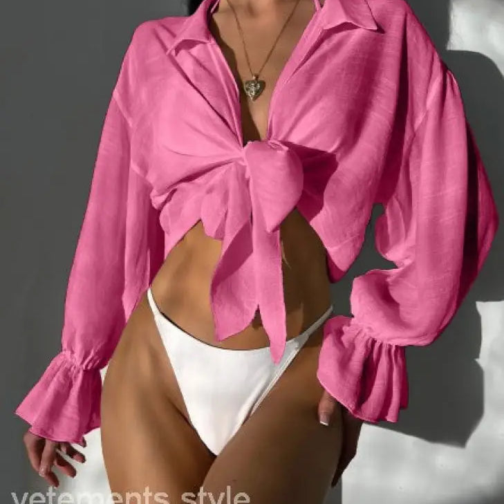 Pink tie-front blouse with ruffled sleeves for summer vacation in royal blue