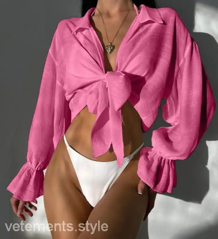 Pink tie-front blouse with ruffled sleeves for summer vacation in royal blue
