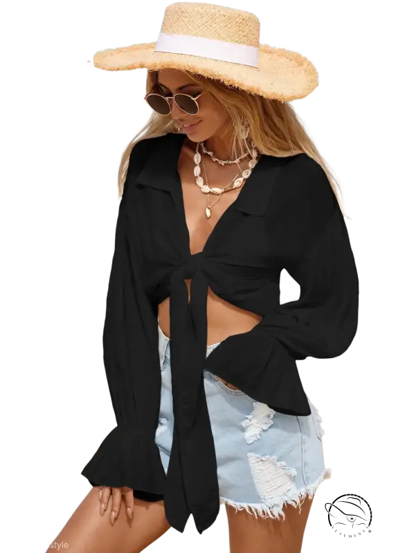 Woman in royal blue boho tie sleeve top and straw hat