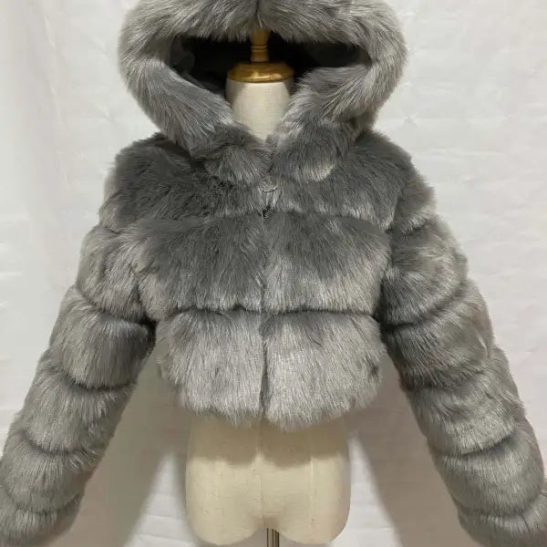 Royal blue faux fur coat with silver fox hooded jacket on mannequin