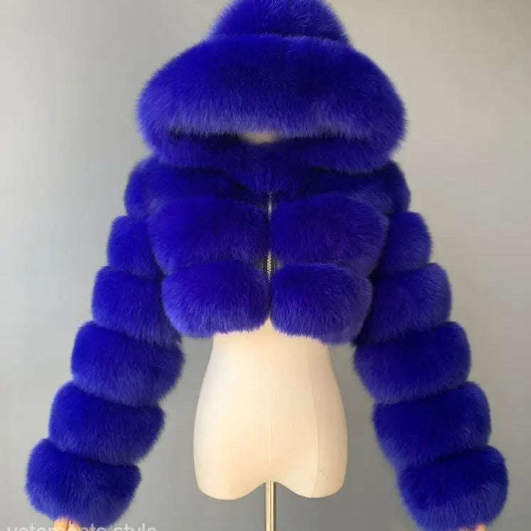 Royal blue faux fur coat with hood on mannequin torso