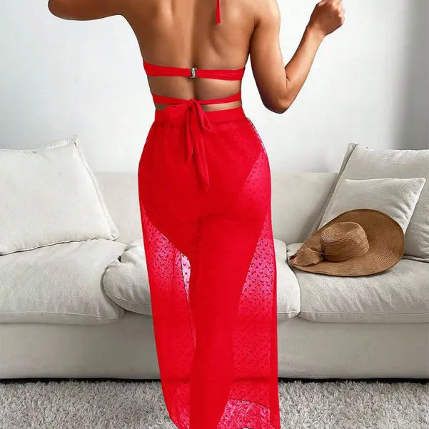 Red halter swimsuit cover-up paired with royal blue sexy maxi swimsuit with lace accents