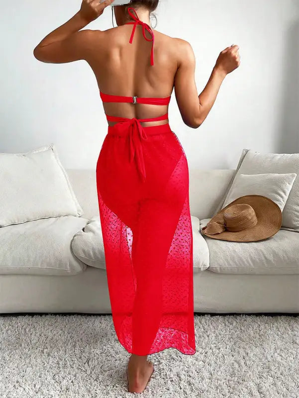 Red halter swimsuit cover-up paired with royal blue sexy maxi swimsuit with lace accents