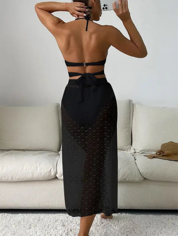 Black halter swimsuit with sheer skirt, part of the Royal Blue Maxi Swimsuit collection