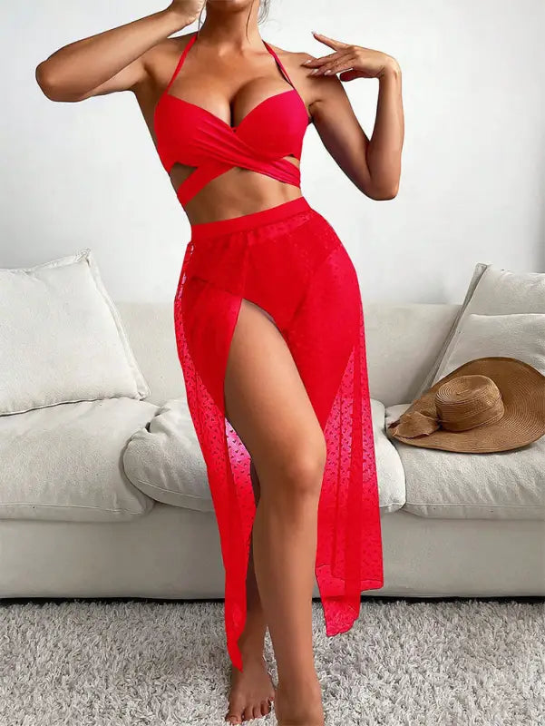 Red halter bikini with sheer skirt displayed on a royal blue sexy maxi swimsuit mannequin
