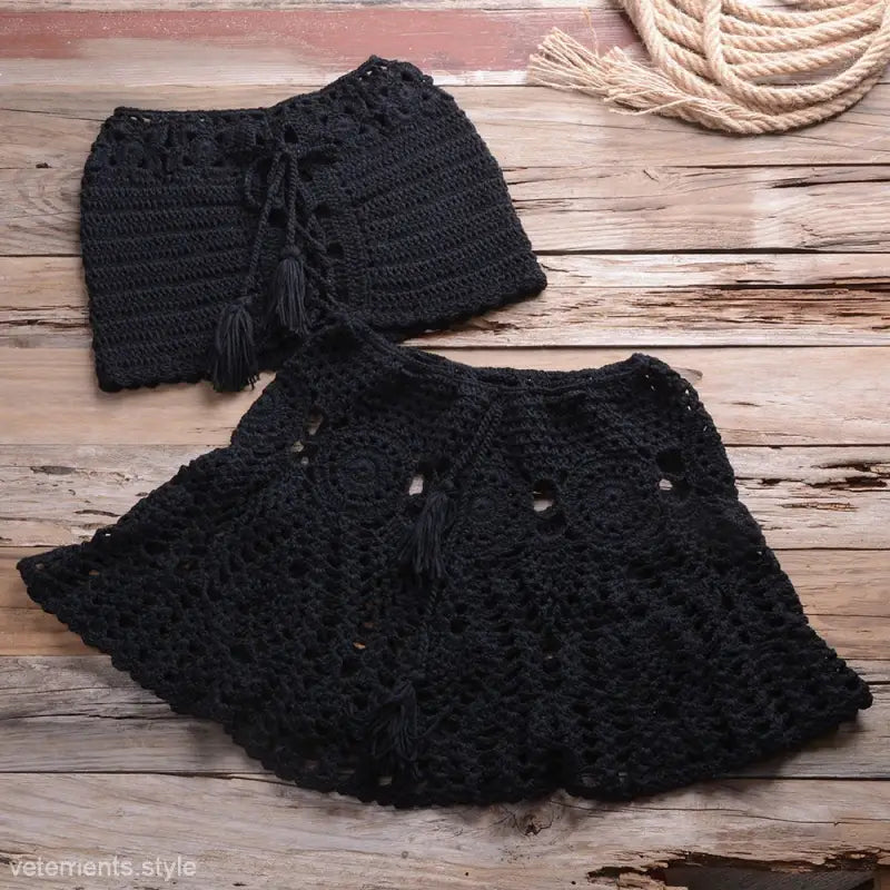 Black crocheted skirt and top set with tasseled drawstrings for a rusty red beach dress strap