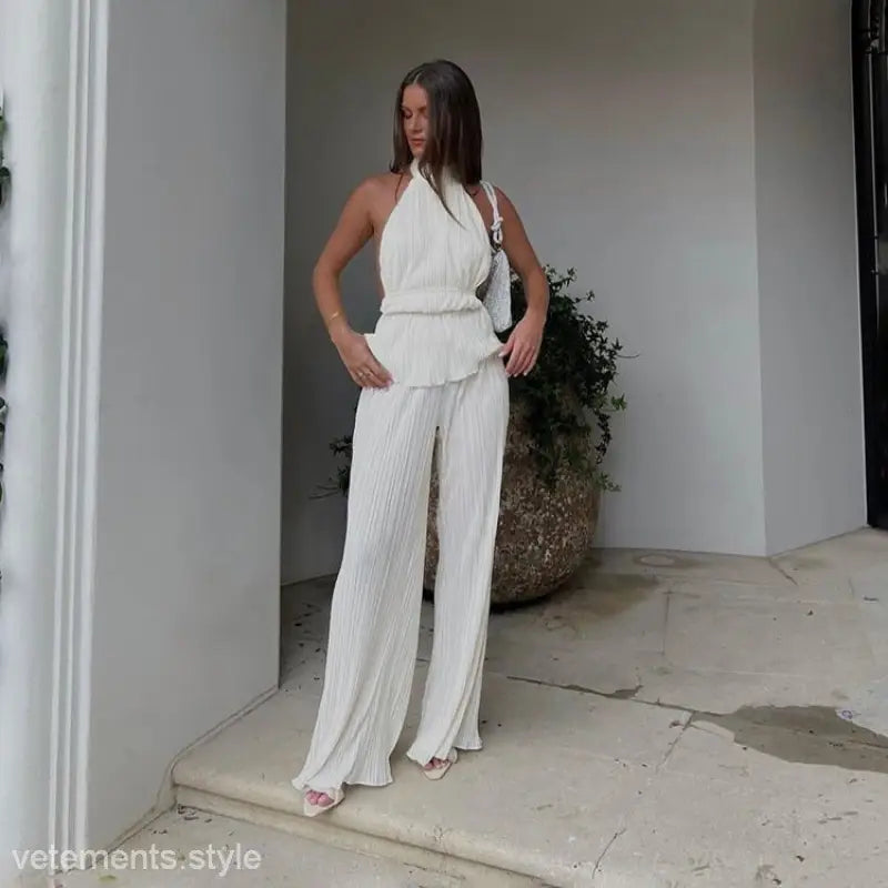 Woman in white halter sexy backless vest from Sama Elegant Suit for summer fashion