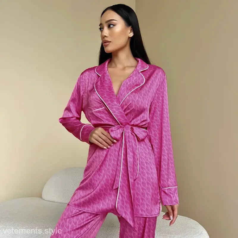 Pink patterned satin comfy pajamas set featuring belted long sleeves and two-piece design