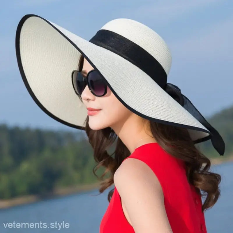 Wide-brimmed white sun hat with black band from Satin Lace Straw Hat navy blue solid collection
