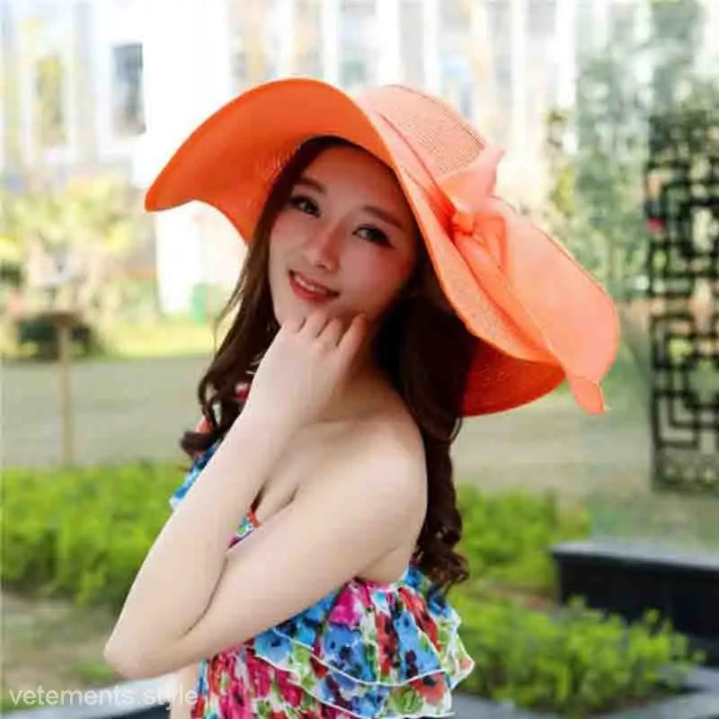 Vibrant orange wide-brimmed sun hat with bow detail for Navy Blue Solid and Light Purple styles