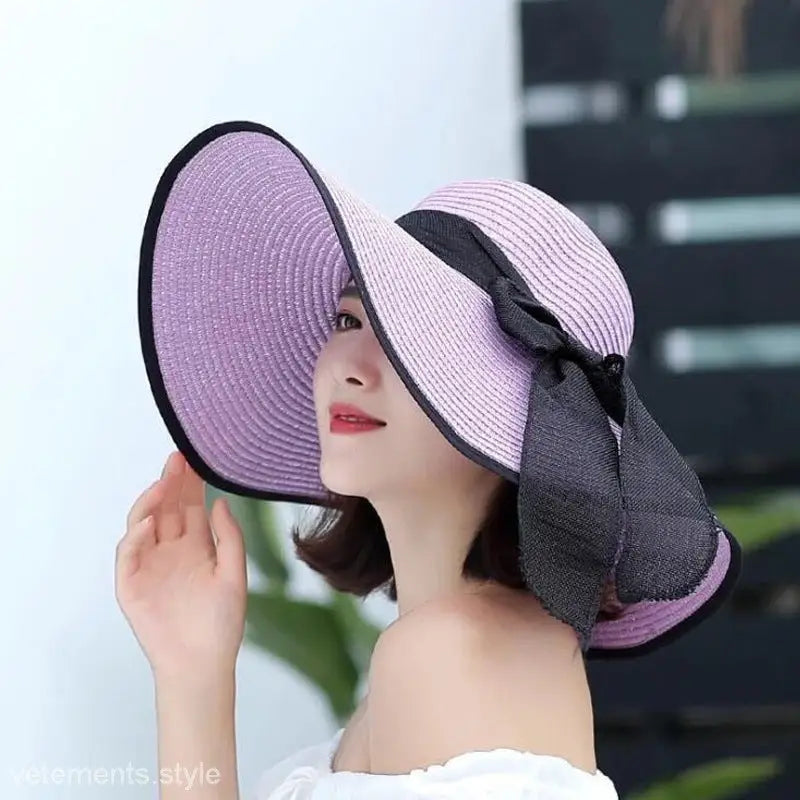 Lavender sun hat with black ribbon bow and trim, perfect for navy blue solid style