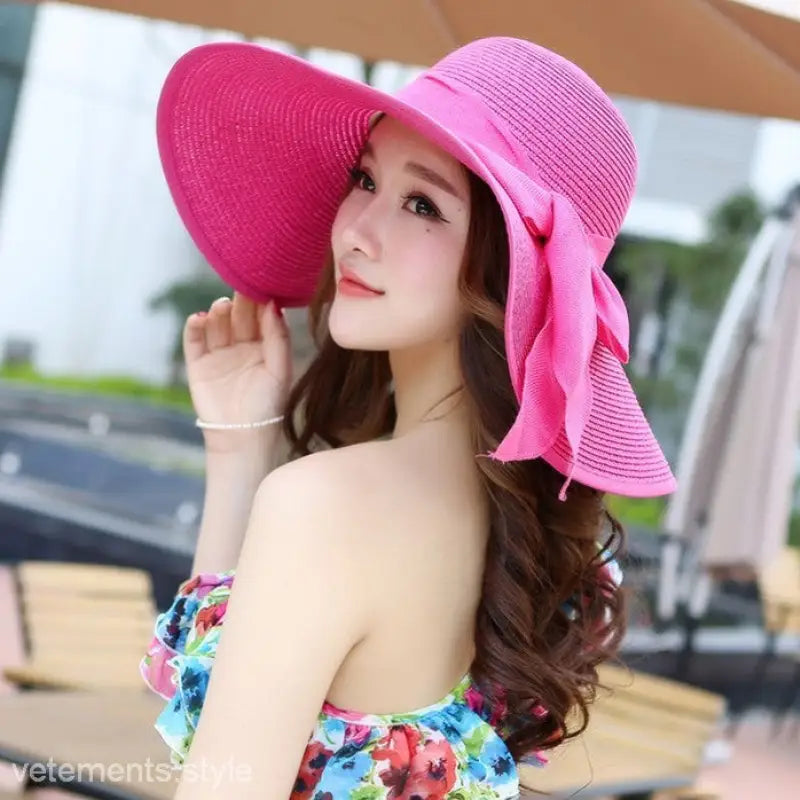 Bright pink wide-brimmed sun hat with ribbon accent, ideal with Navy Blue Solid and vibrant colors