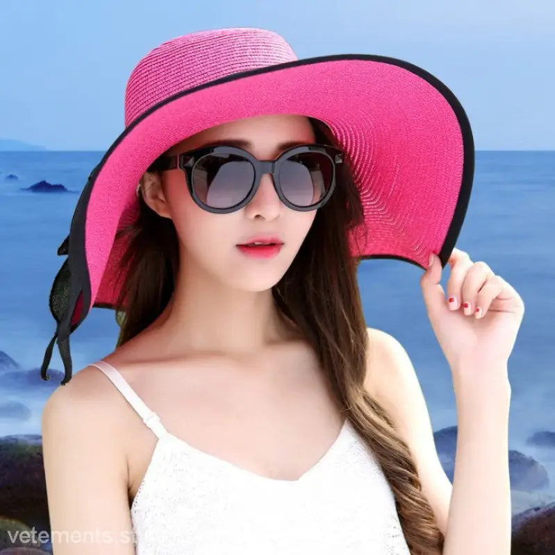Bright pink wide-brimmed sun hat with black trim, perfect with Navy Blue Solid and light purple accessories