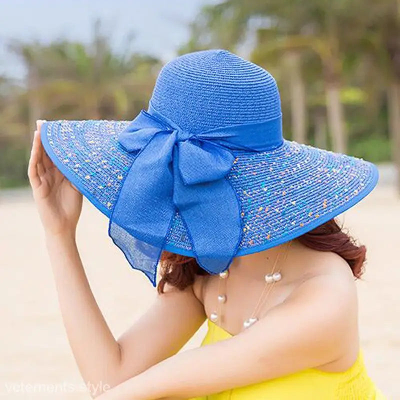Navy blue solid wide-brimmed sun hat with sparkly brim and decorative bow
