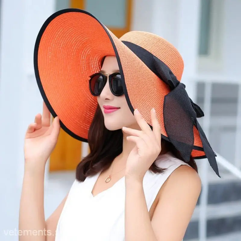 Vibrant orange sun hat with black ribbon, suited for Navy Blue Solid and Light Purple styles