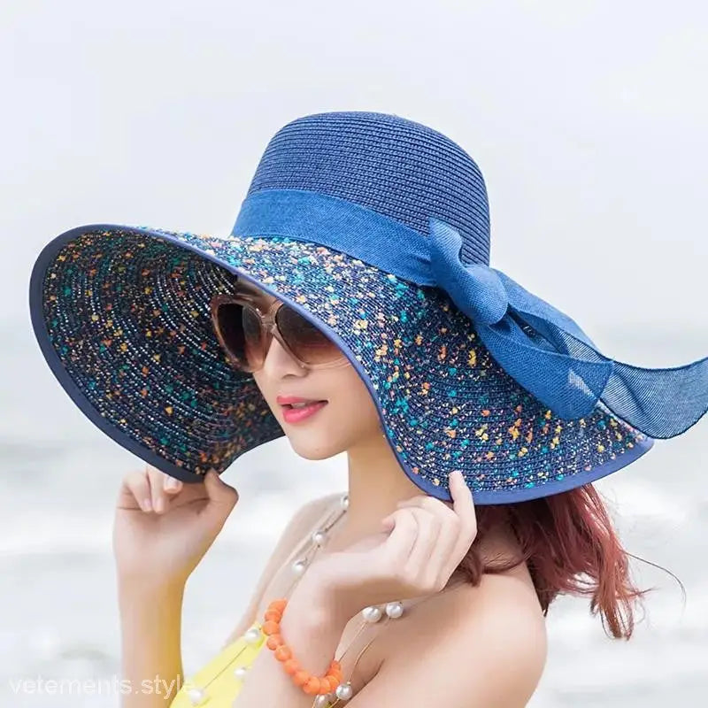 Blue wide-brimmed sun hat with sparkly brim and ribbon bow, perfect for navy blue solid styles