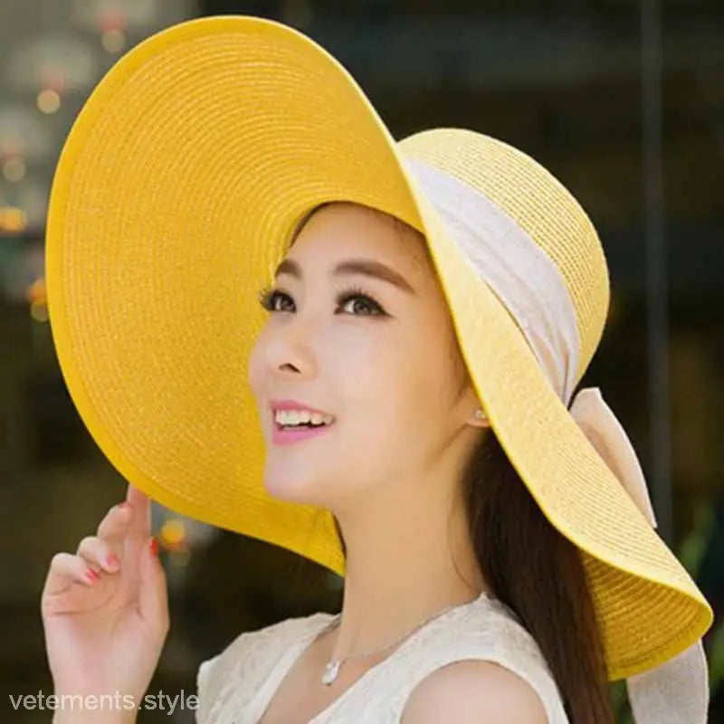 Bright yellow wide-brimmed sun hat with white band, perfect with navy blue solid and blue gypsophila accessories