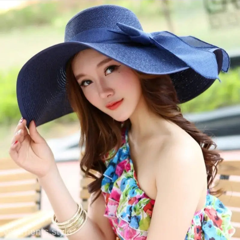 Navy blue solid wide-brimmed sun hat with ribbon accent, perfect for style and sun protection