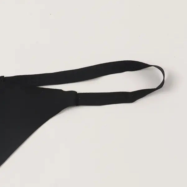 Black bra strap against a light background for ice silk panties in the Seasonless Nylon collection