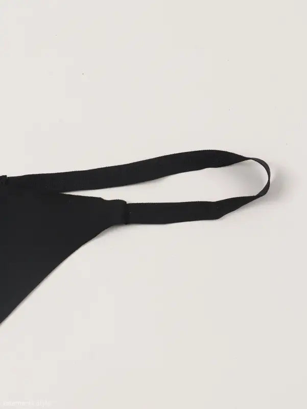 Black bra strap against a light background for ice silk panties in the Seasonless Nylon collection