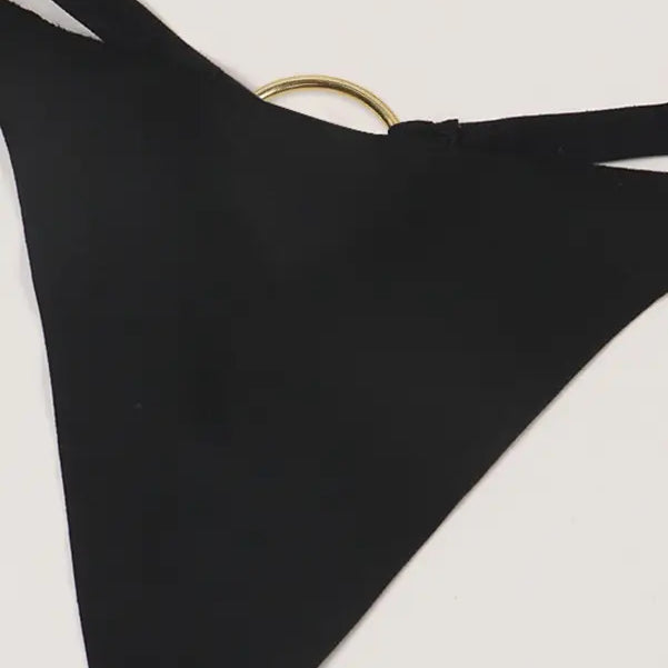 Black triangular fabric piece with a gold ring, part of Seasonless Nylon Ice Silk Panties collection