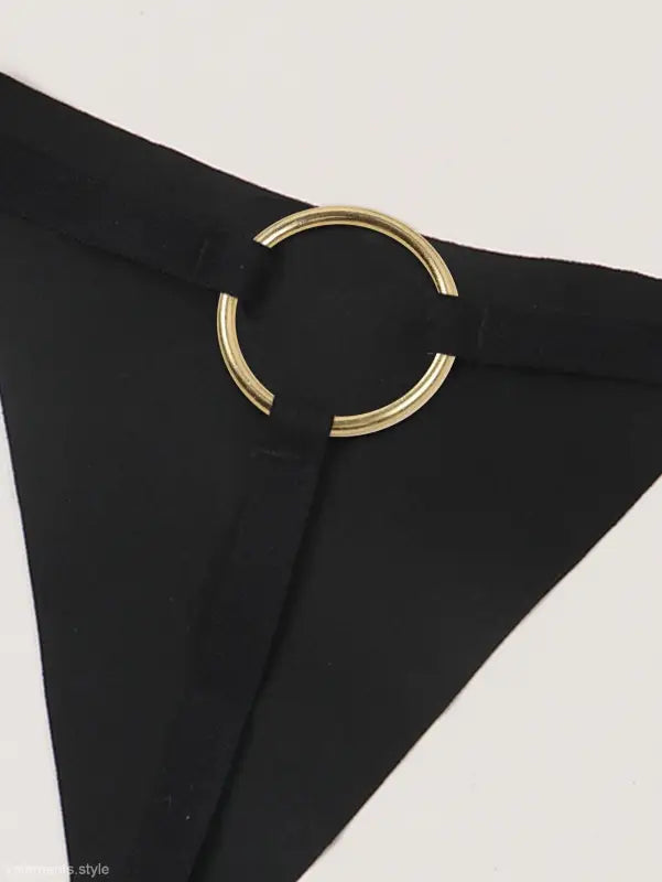Black triangular fabric piece with gold circular clasp for seasonless nylon ice silk panties