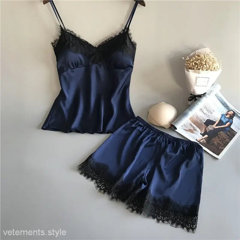 Navy blue satin and lace lingerie set with camisole and shorts for elegant fashion style