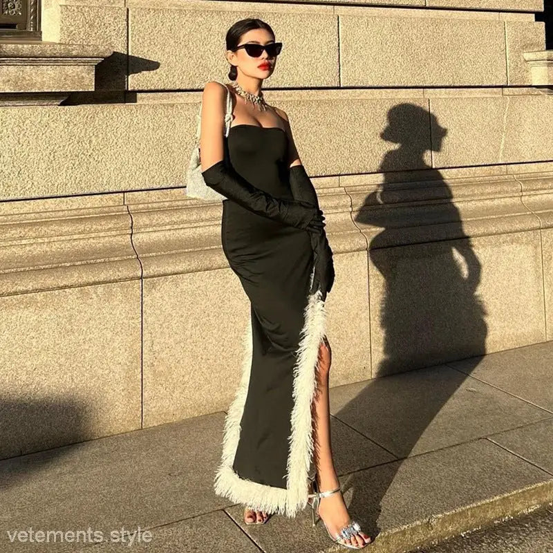Elegant woman in a black evening gown with high grade fur stitching and accessories