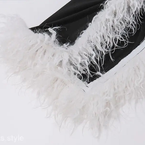 Elegant fluffy white feather against dark background on Maxi Dress with high grade fur stitching