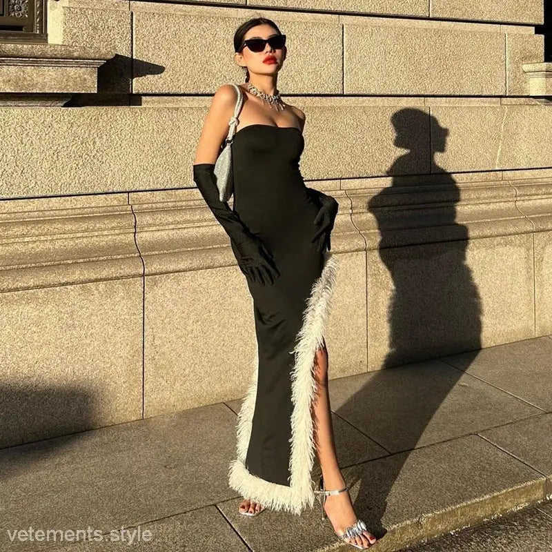 Elegant black evening gown with white feathered trim and high grade fur stitching