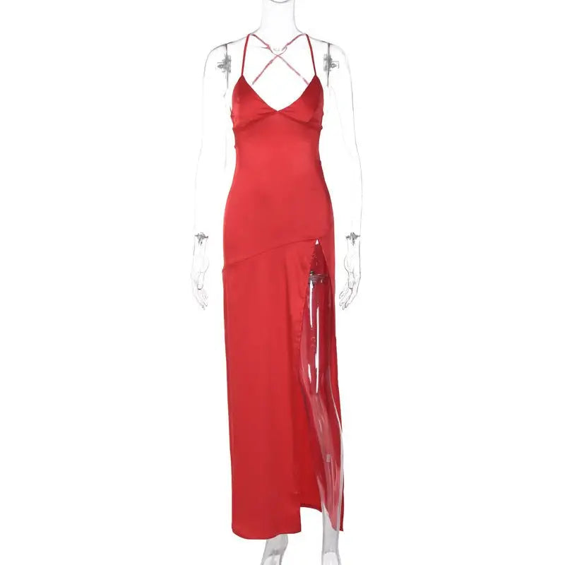 Red floor-length backless dress with spaghetti straps and high slit, ideal for summer events