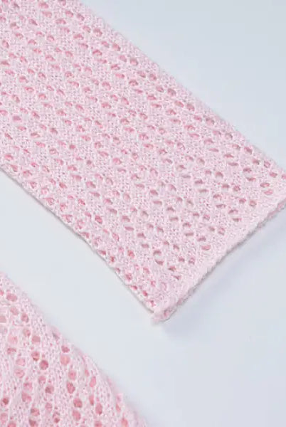Pink crocheted garment sleeve detail from a backless knitted dress for parties