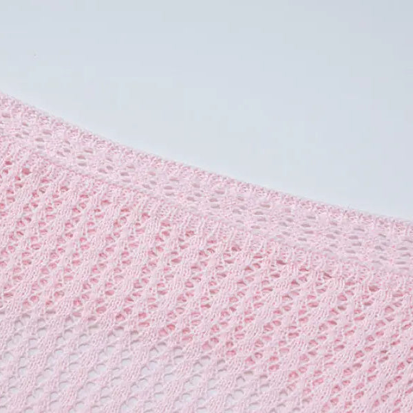 Pink crocheted fabric showcasing a backless knitted dress for parties and clubs