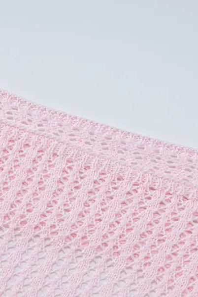 Pink crocheted fabric showcasing a backless knitted dress for parties and clubs