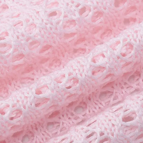 Pink open-knit fabric showcasing a sexy backless knitted dress for parties and clubs