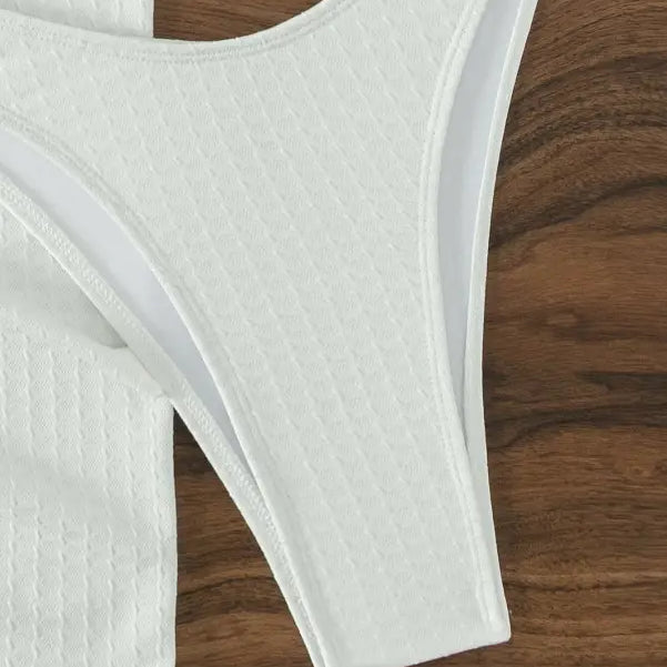 White high-cut thong bottom in sexy boho swimsuit beach bikini