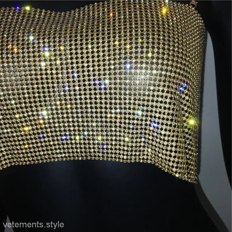 Glittering gold mesh fabric with multicolored reflections on a sexy chain camisole corset