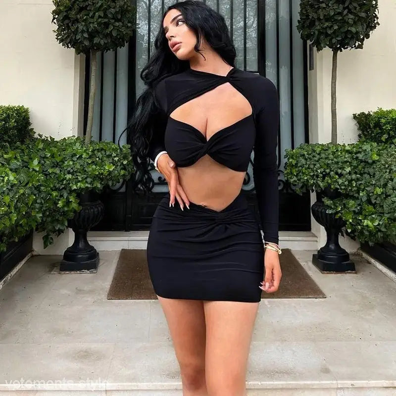 Black two-piece dress featuring a sexy cutout long sleeve crop top and a long sleeve dress