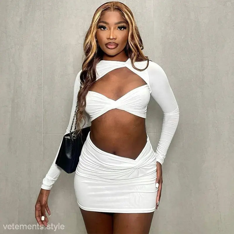 Woman in a white long sleeve dress with sexy cutout long sleeve design for style