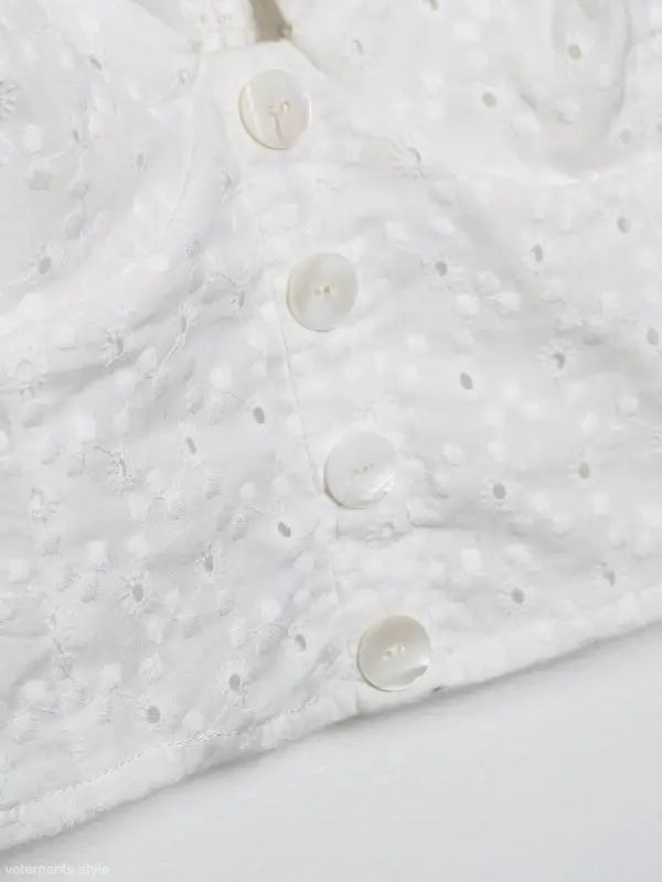 White eyelet fabric with buttons in a Sexy French Niche Hollow Cutout Cotton Crop Top
